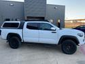 Full passenger side view of Economy Roof Rack from on a white Toyota Tacoma - Cali Raised LED