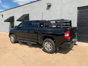 Rear drivers side view of black Toyota Tundra with Overland Bed Rack - Cali Raised LED