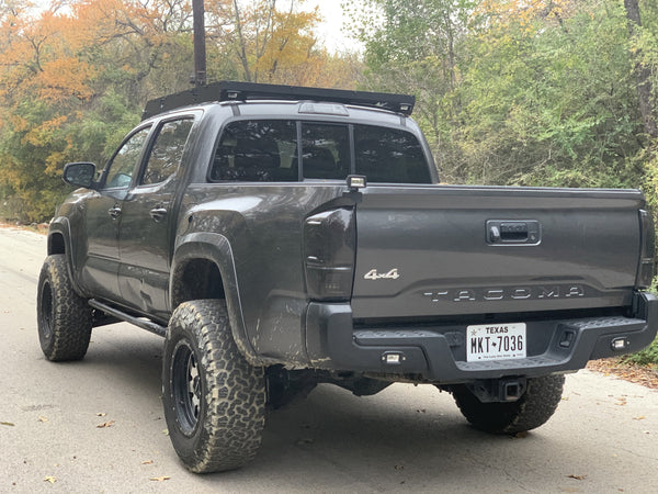 Rear view of gray Toyota Tacoma with Premium roof rack - Cali Raised LED